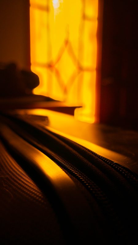 Warm light glowing through translucent fabric.